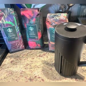 Starbucks coffee press and 3 bags of coffee